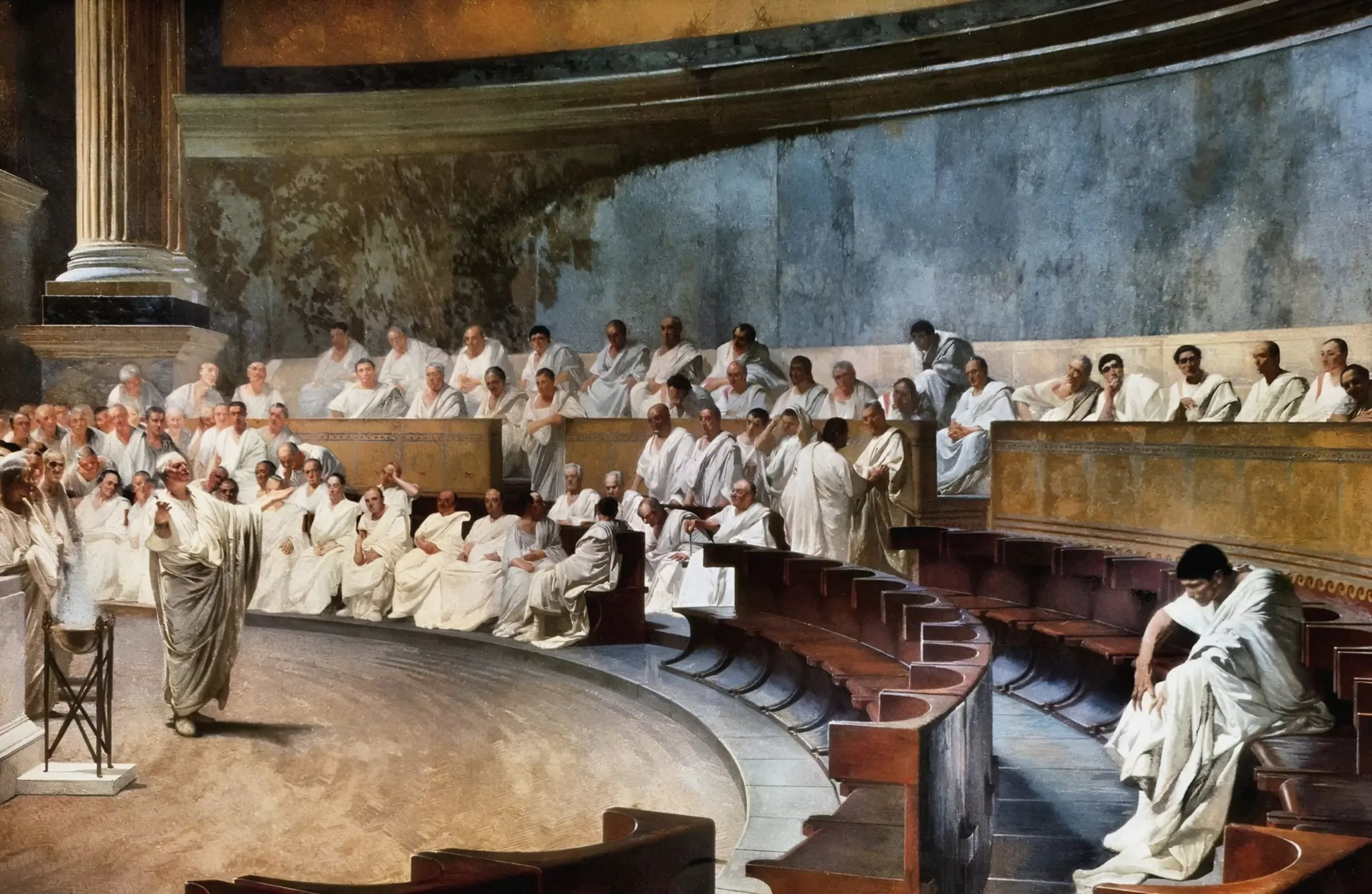 Cicero obtoži Katilino, Cesare Maccari, 1889, javna domena; vir: Wikimedia Commons, File: Cicero_Denounces_Catiline_in_the_Roman_Senate_by_Cesare_Maccari.png, dostop 5. 1. 2026. Na fotografiji lahko vidimo kasnejšo upodobitev zasedanja rimskega senata v 1. stoletju pr. n. št.